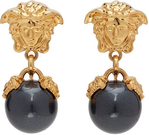 black and gold medusa earrings